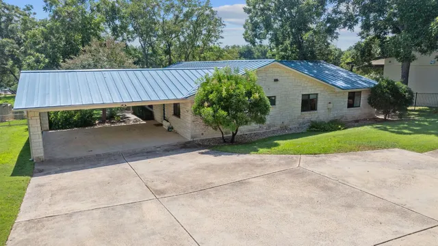 swimming pool view with a seating space