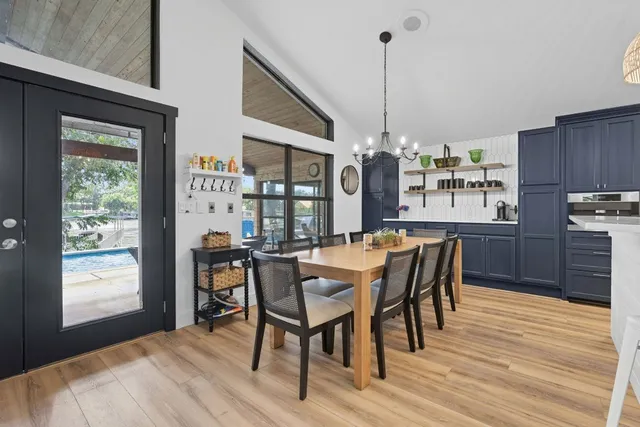a dining room with furniture and window
