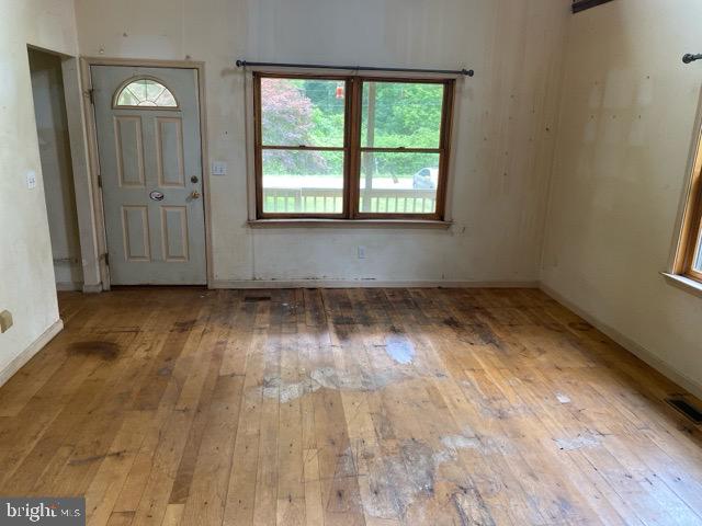 1419 Glencoe Road Sparks Glencoe, MD 21152 - Photo 2 of 12 an empty room with wooden floor and windows