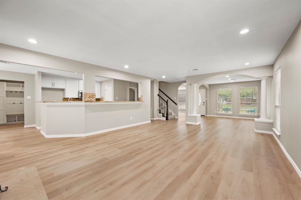 2704 Ridgemere Drive Flower Mound, TX 75028 - Photo 12 of 40 a view of a kitchen with wooden floor and a kitchen