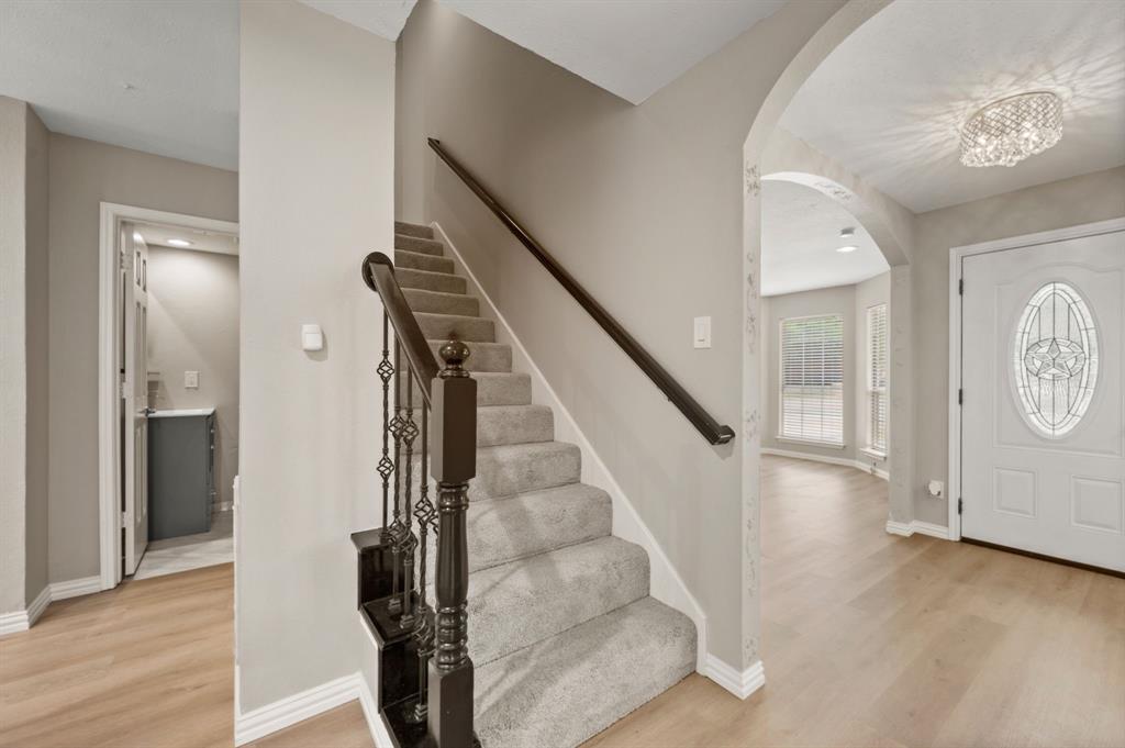 2704 Ridgemere Drive Flower Mound, TX 75028 - Photo 21 of 40 a view of an entryway with wooden floor
