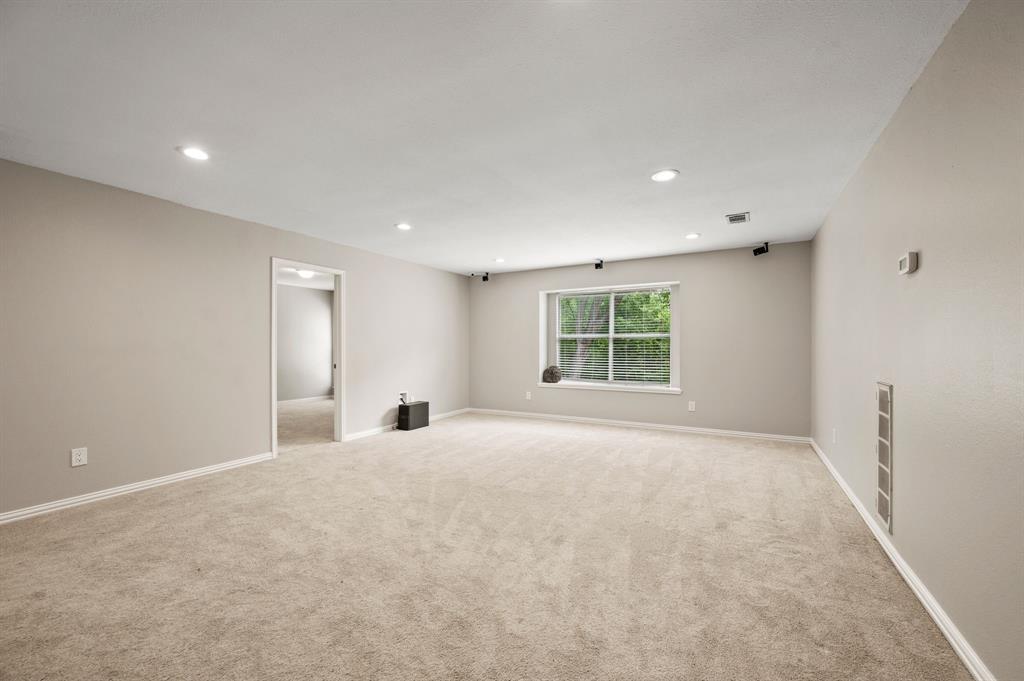 2704 Ridgemere Drive Flower Mound, TX 75028 - Photo 22 of 40 a view of an empty room with a window