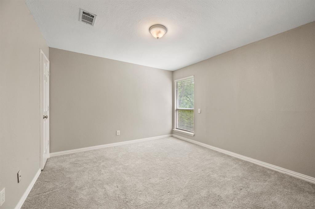 2704 Ridgemere Drive Flower Mound, TX 75028 - Photo 33 of 40 a view of an empty room with a window