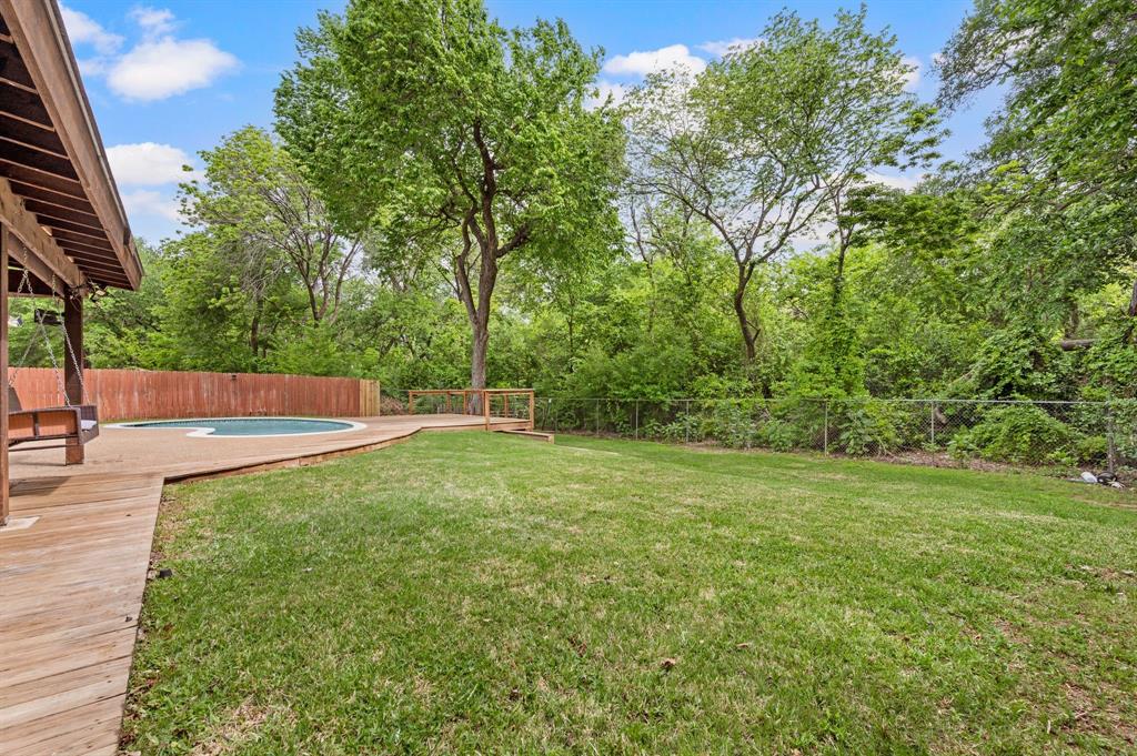 2704 Ridgemere Drive Flower Mound, TX 75028 - Photo 35 of 40 a view of a field with trees in the background
