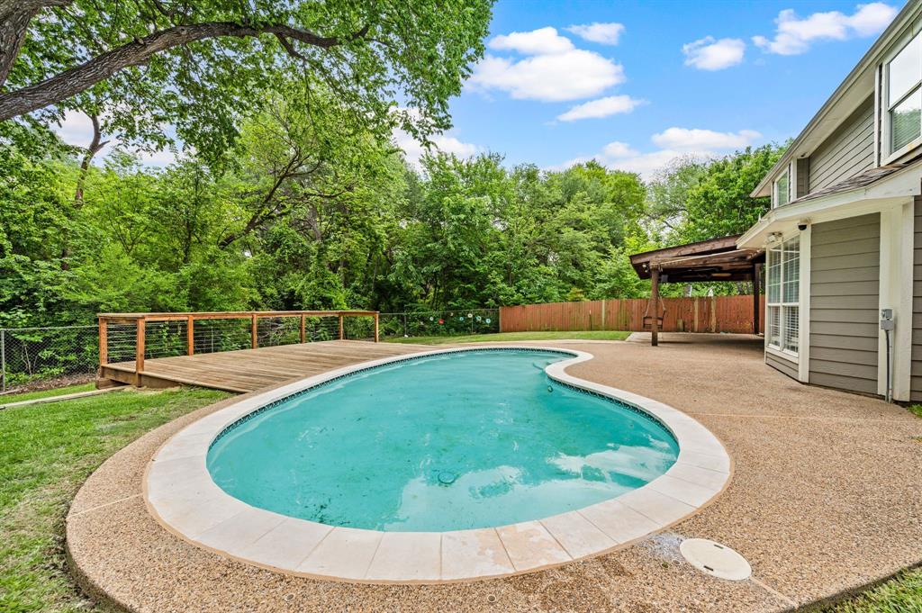 2704 Ridgemere Drive Flower Mound, TX 75028 - Photo 37 of 40 a view of a swimming pool with a yard