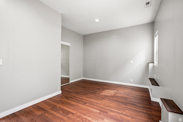 2154 Wasatch Boulevard Sandy, UT 84092 - Photo 31 of 32 Spacious room featuring wood-finish flooring, light grey walls, and white trim