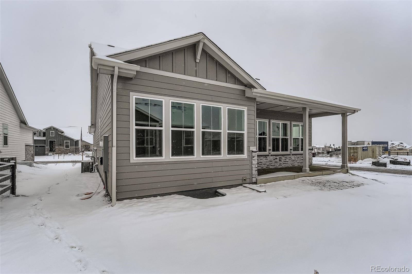 8902 South Riviera Way Aurora, CO 80016 - Photo 24 of 26 a view of house and car parked in front of house