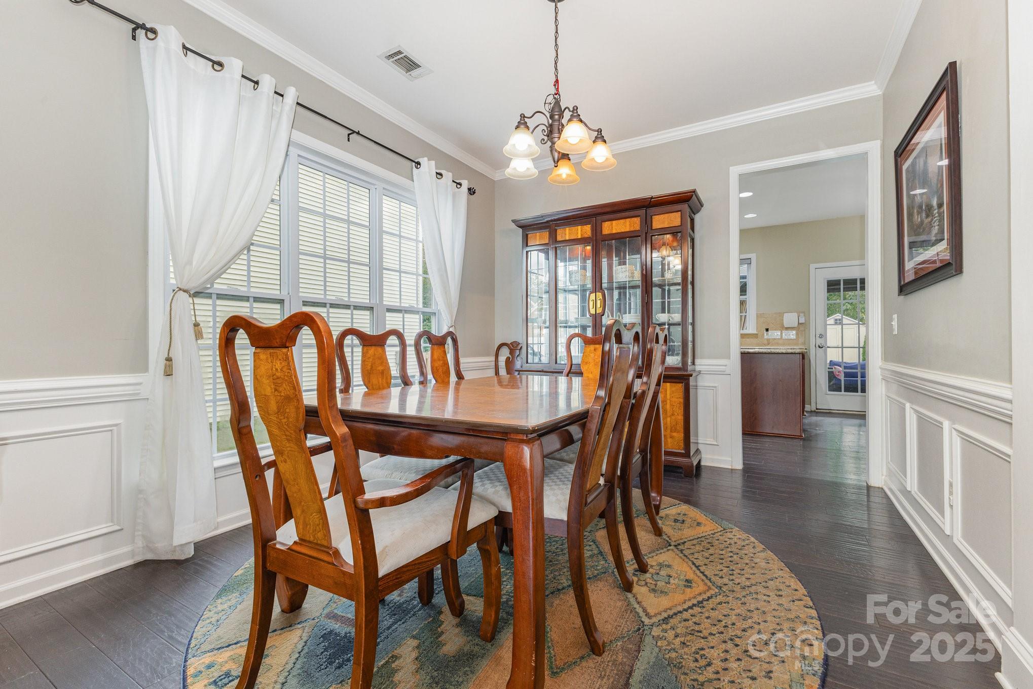 3384 Dunbar Lane Fort Mill, SC 29707 - Photo 11 of 34 a view of a dining room with furniture and chandelier