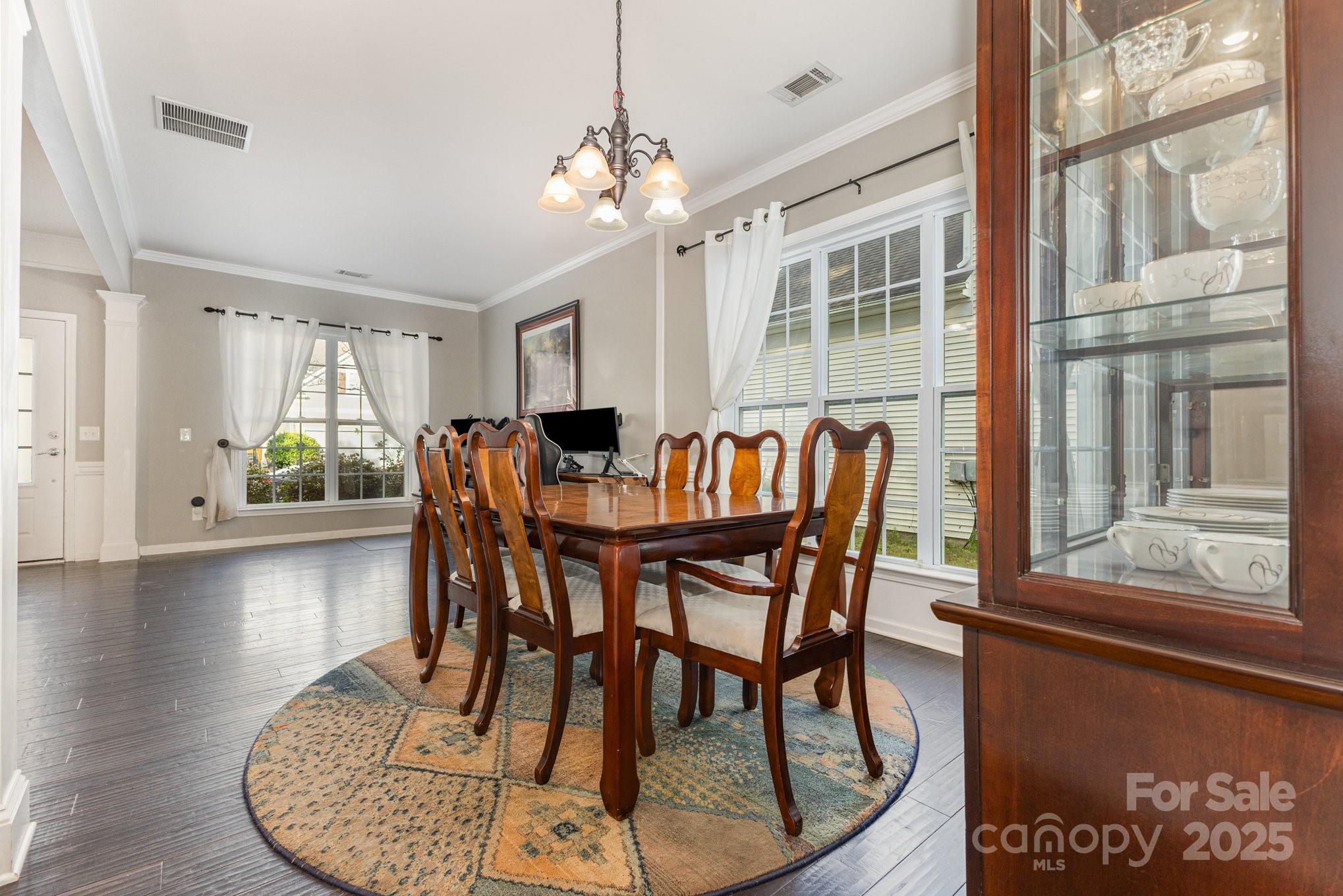 3384 Dunbar Lane Fort Mill, SC 29707 - Photo 12 of 34 a dining room with furniture window and wooden floor