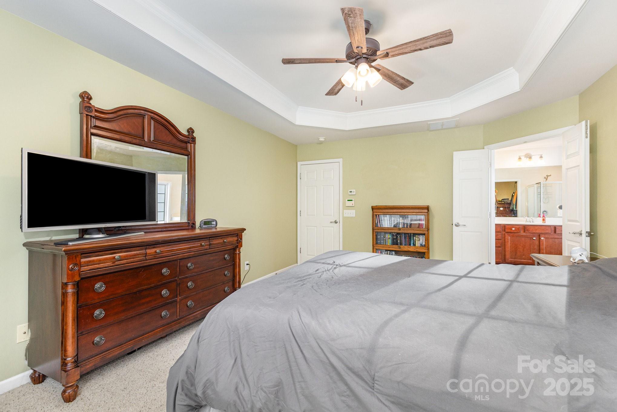 3384 Dunbar Lane Fort Mill, SC 29707 - Photo 20 of 34 a bedroom with a bed and a flat screen tv
