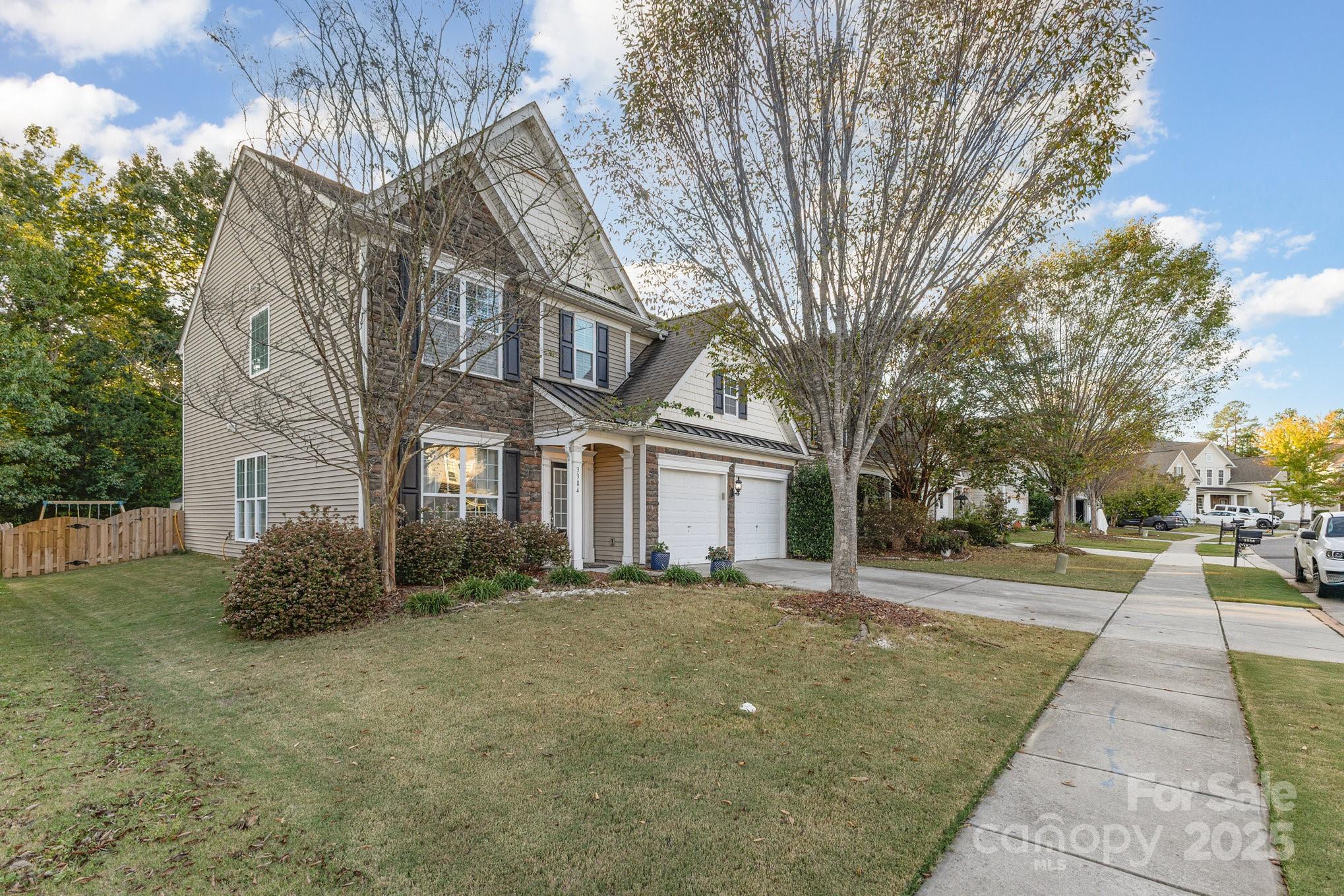 3384 Dunbar Lane Fort Mill, SC 29707 - Photo 2 of 34 a front view of a house with a yard