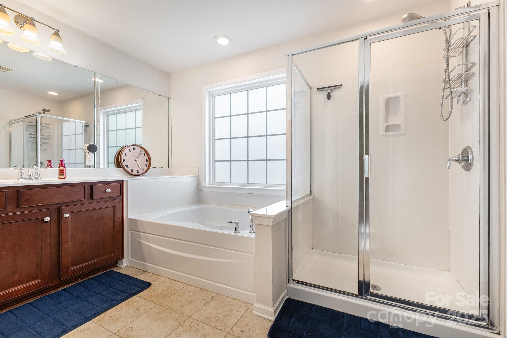 3384 Dunbar Lane Fort Mill, SC 29707 - Photo 21 of 34 a bathroom with a tub a sink and a shower