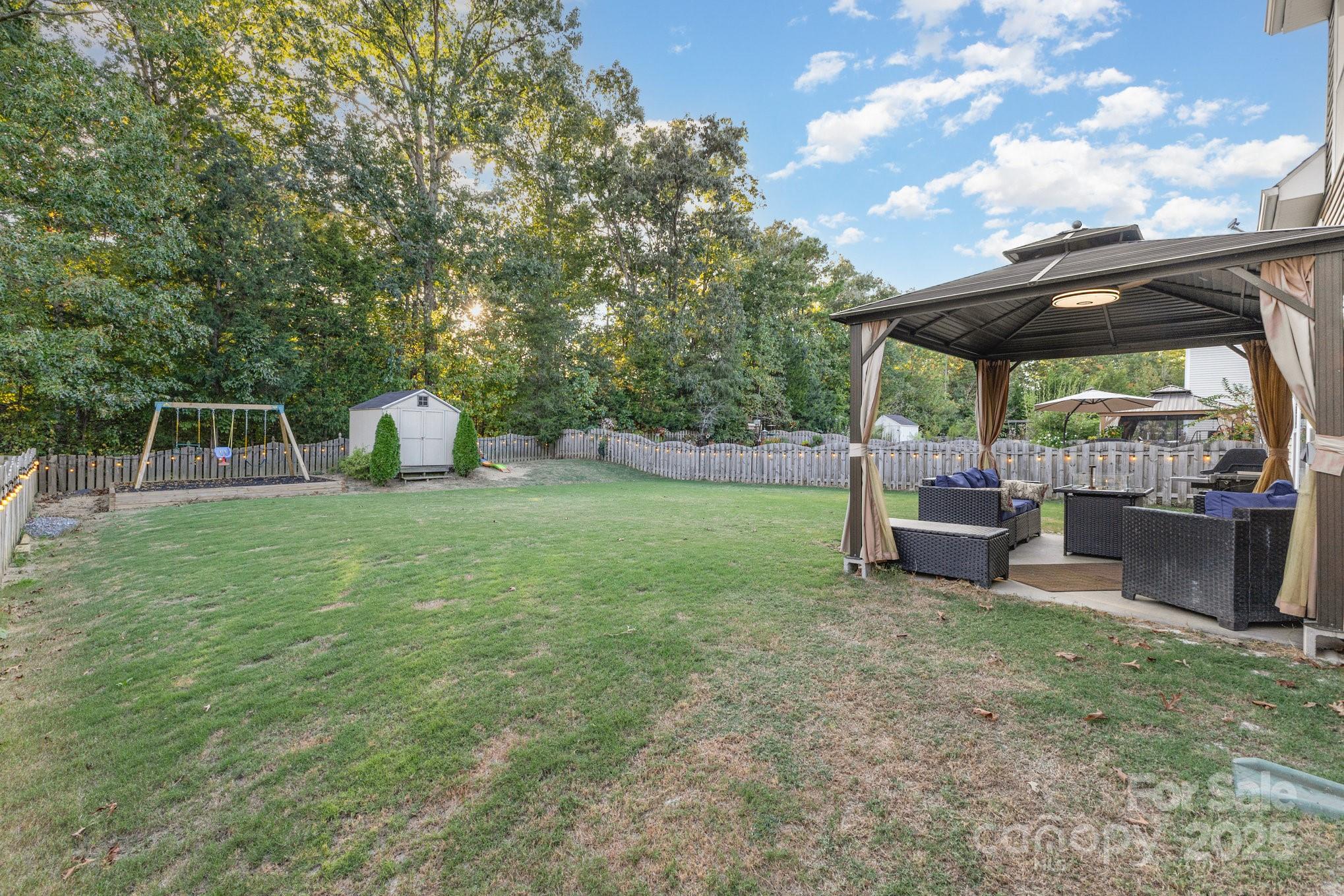 3384 Dunbar Lane Fort Mill, SC 29707 - Photo 32 of 34 a view of a backyard with sitting area