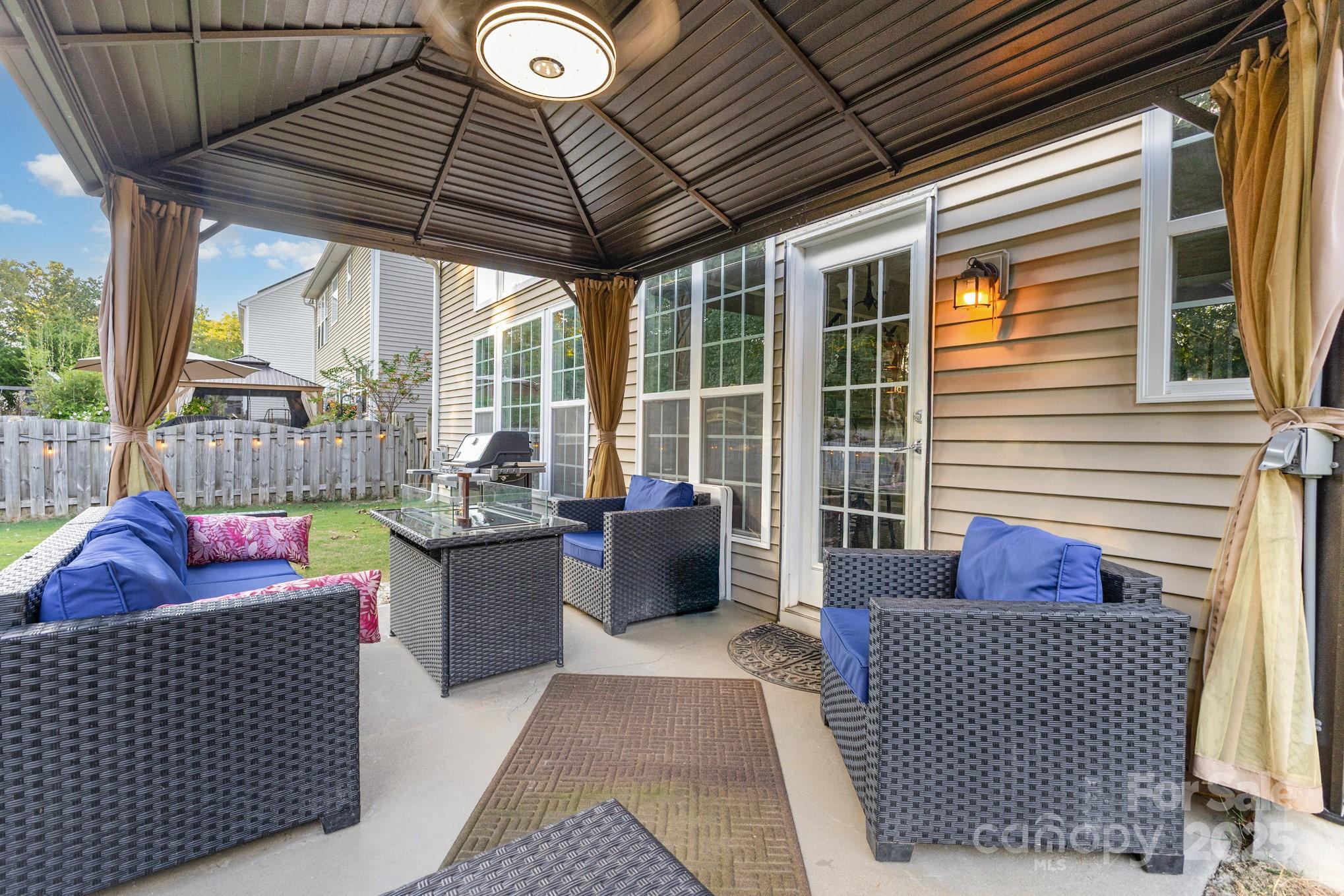3384 Dunbar Lane Fort Mill, SC 29707 - Photo 34 of 34 a outdoor living space with furniture and iron gate