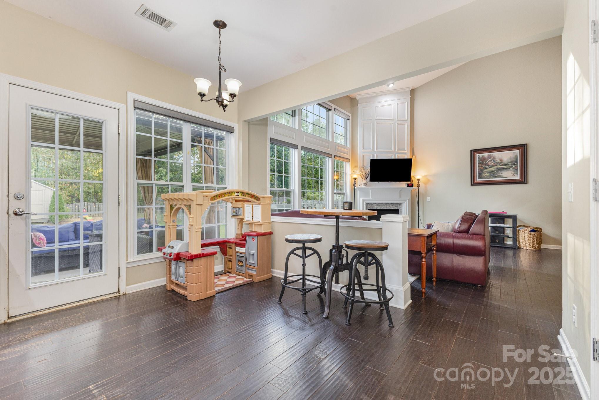3384 Dunbar Lane Fort Mill, SC 29707 - Photo 7 of 34 a bedroom with furniture window and wooden floor