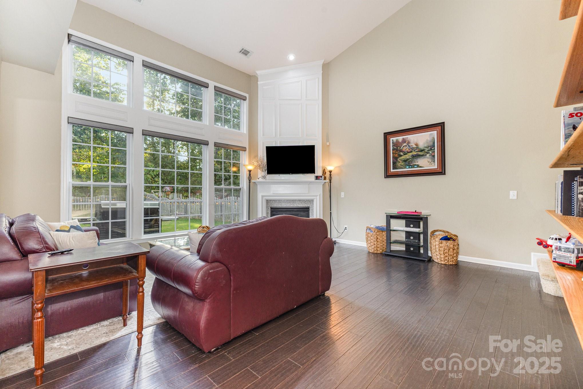 3384 Dunbar Lane Fort Mill, SC 29707 - Photo 8 of 34 a living room with furniture large window and a flat screen tv