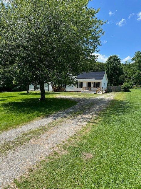 108 Conner Drive Clayton, NC 27520 - Photo 2 of 14 a view of outdoor space with garden and trees