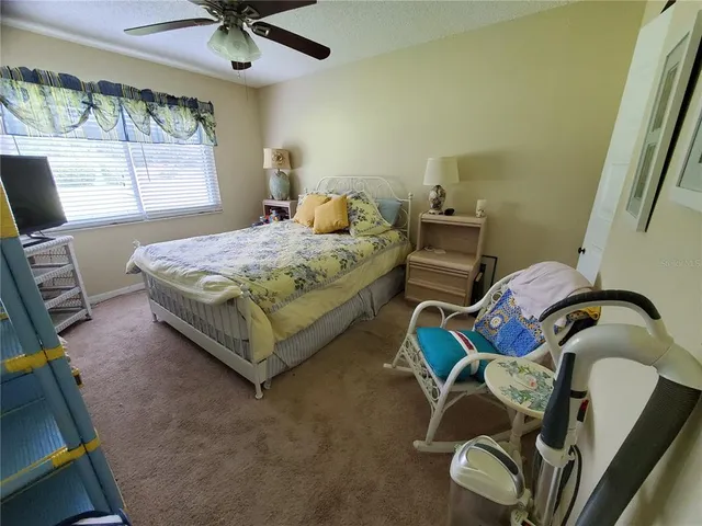 a bedroom with a bed and furniture