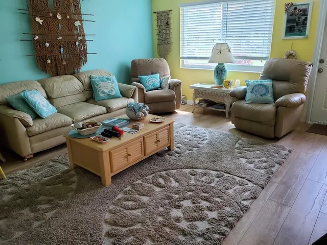 a kitchen with stainless steel appliances granite countertop a refrigerator a stove and a sink