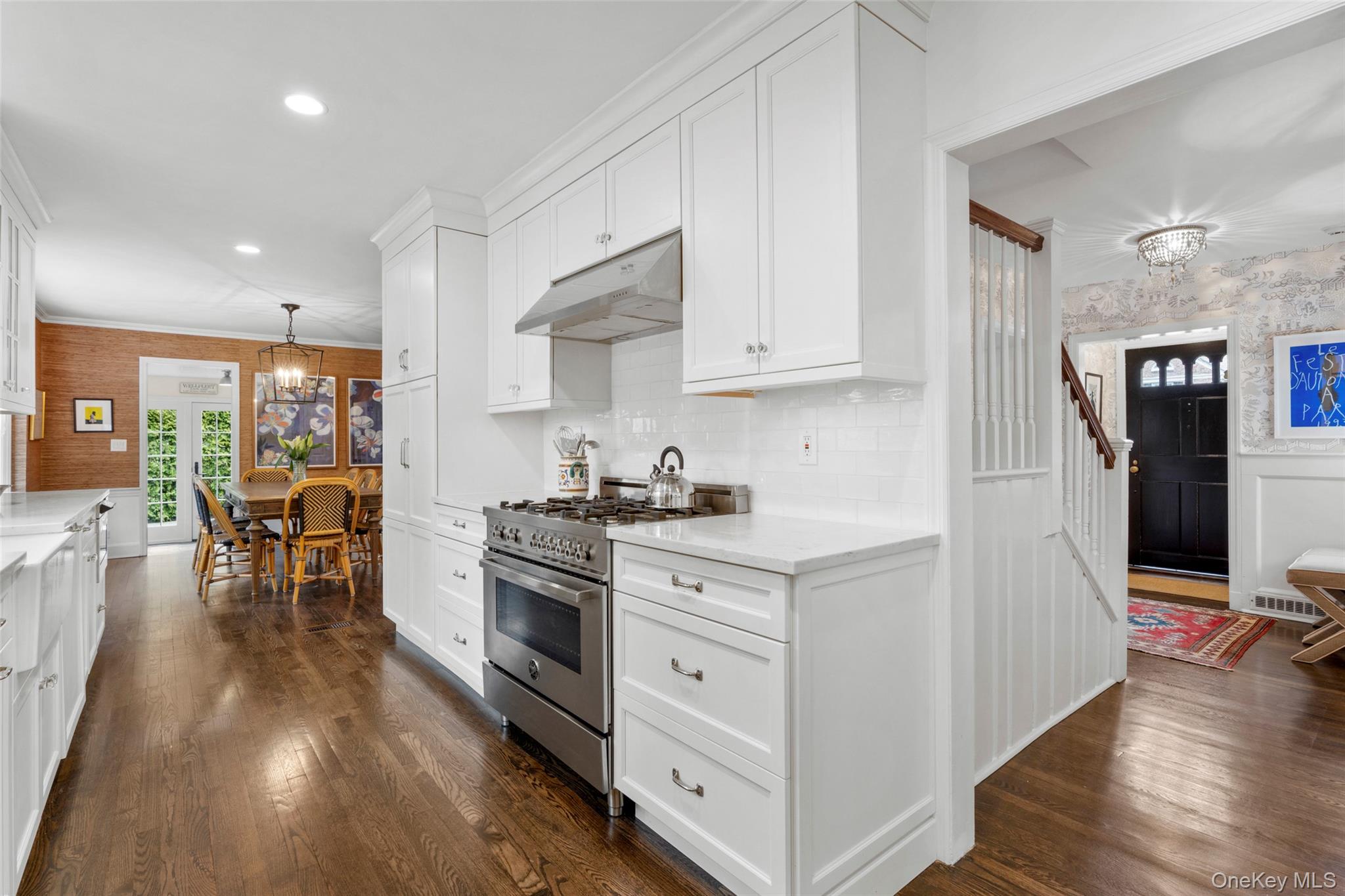 111 Berrian Road New Rochelle, NY 10804 - Photo 11 of 33 a kitchen with stainless steel appliances granite countertop a stove and a refrigerator