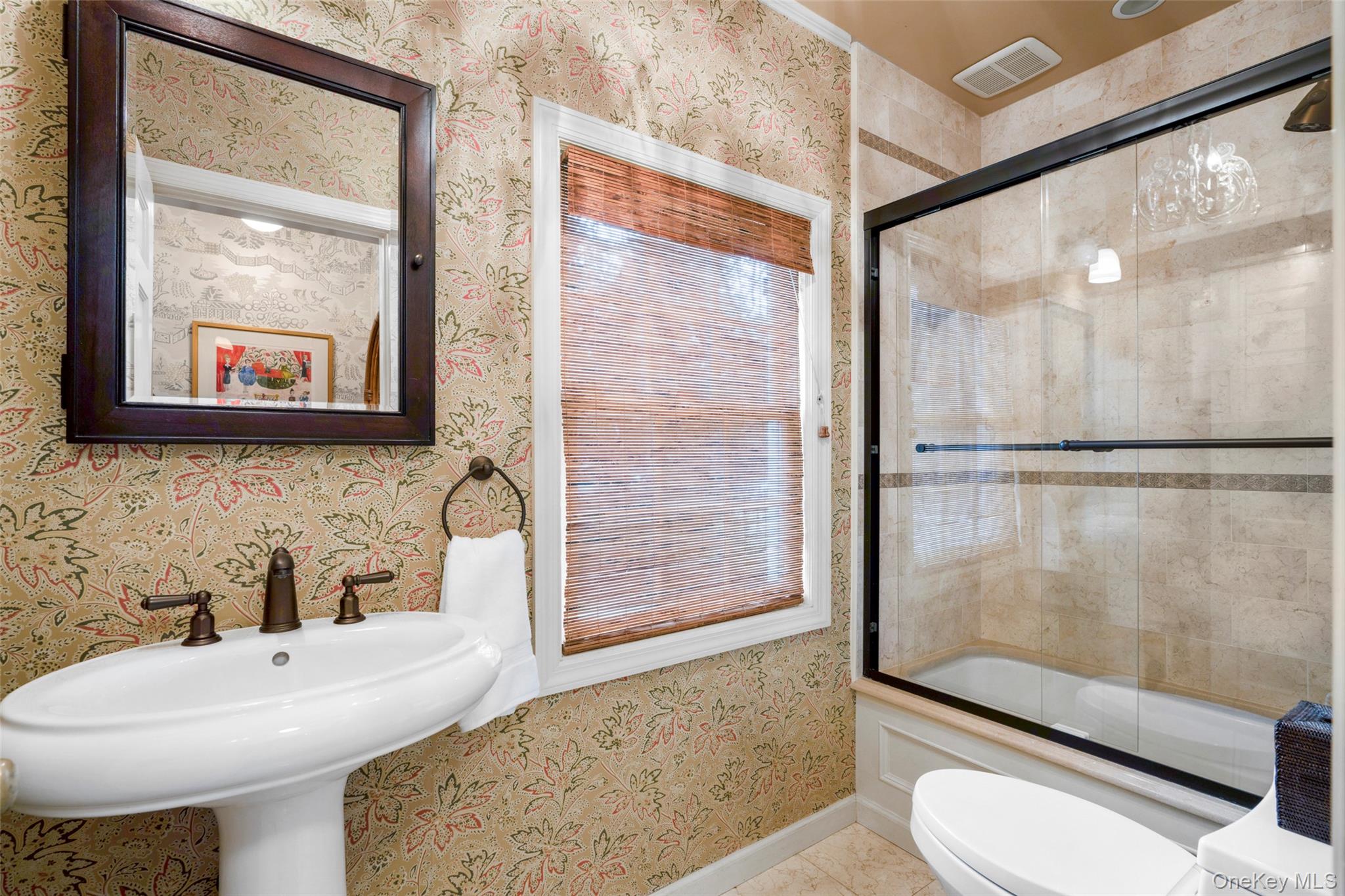 111 Berrian Road New Rochelle, NY 10804 - Photo 13 of 33 a bathroom with a sink toilet and shower