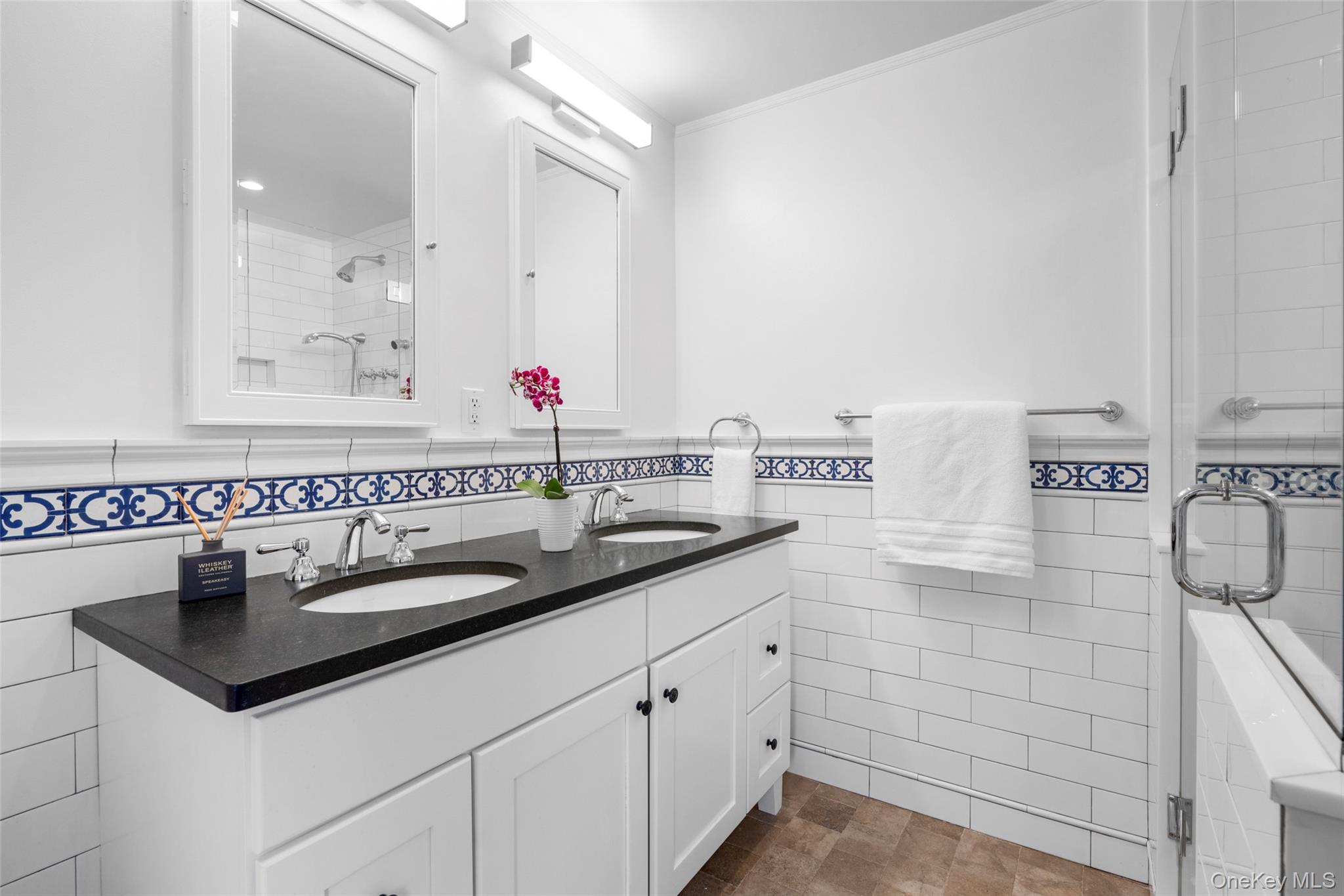 111 Berrian Road New Rochelle, NY 10804 - Photo 18 of 33 a bathroom with a sink and a mirror