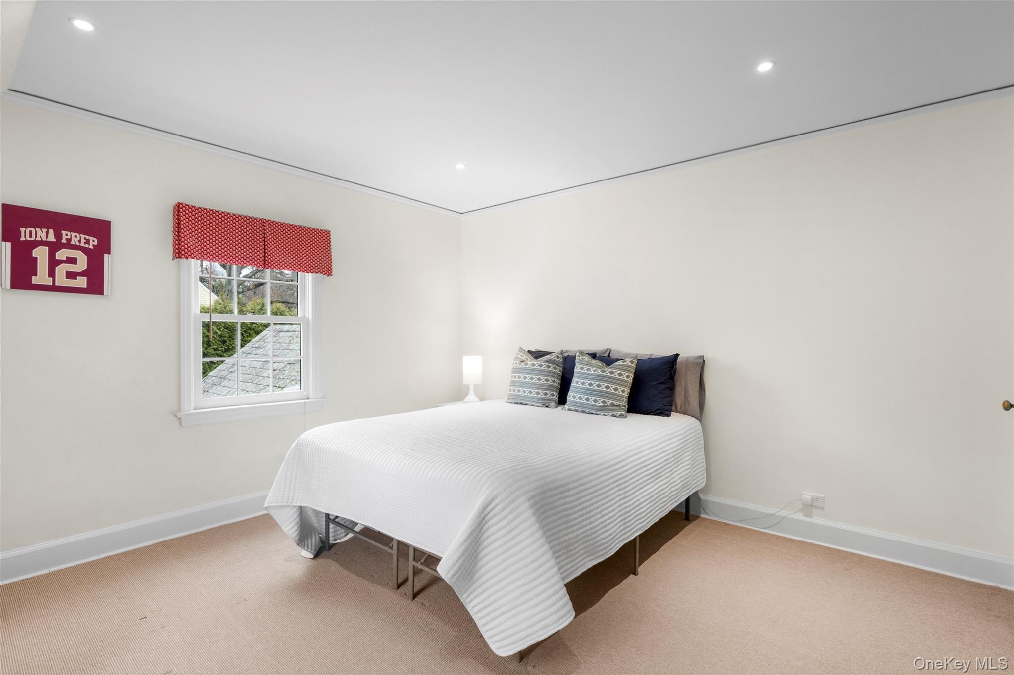 111 Berrian Road New Rochelle, NY 10804 - Photo 19 of 33 a bedroom with a bed and a window