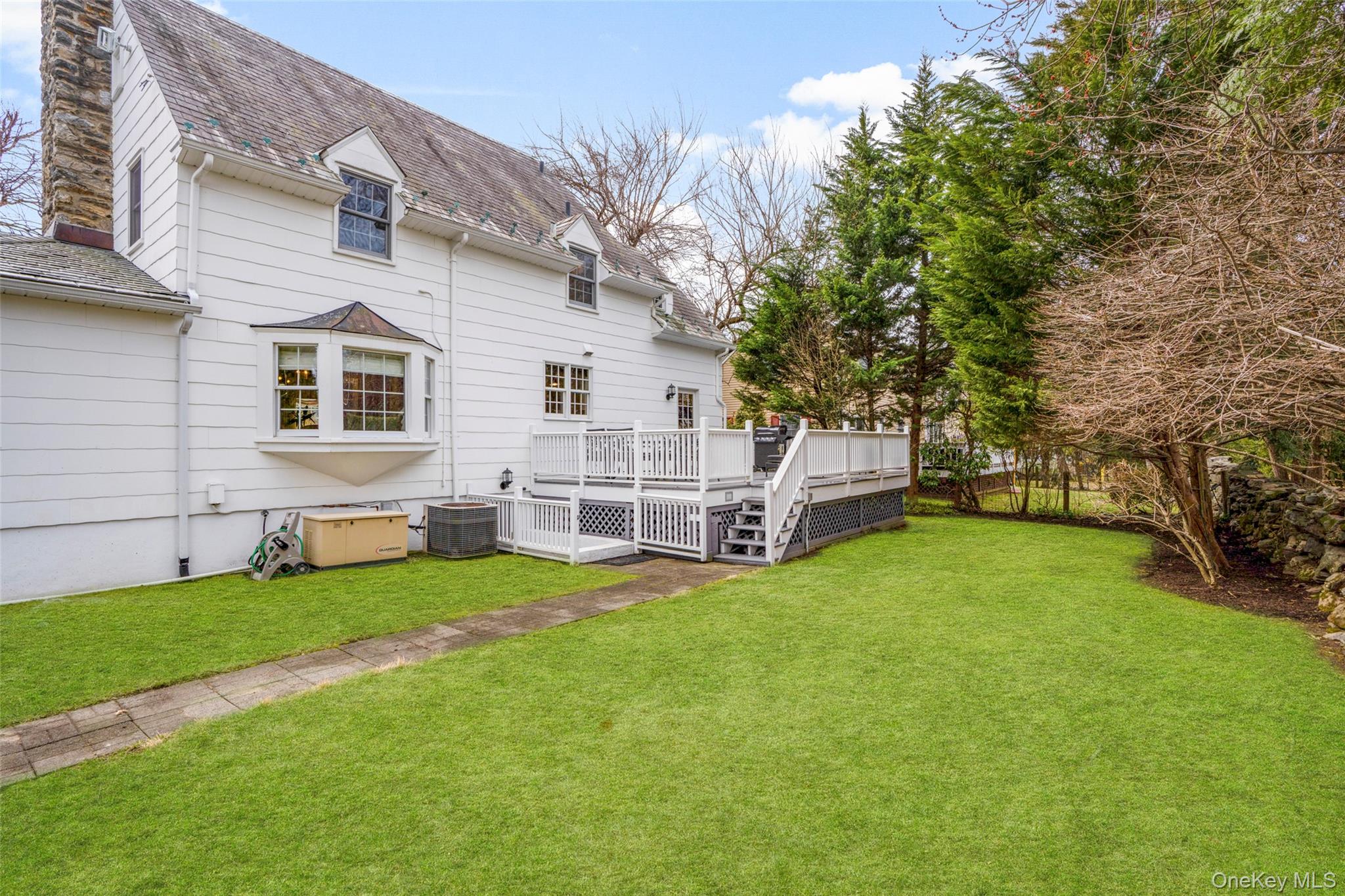 111 Berrian Road New Rochelle, NY 10804 - Photo 28 of 33 a view of a house with backyard porch and garden