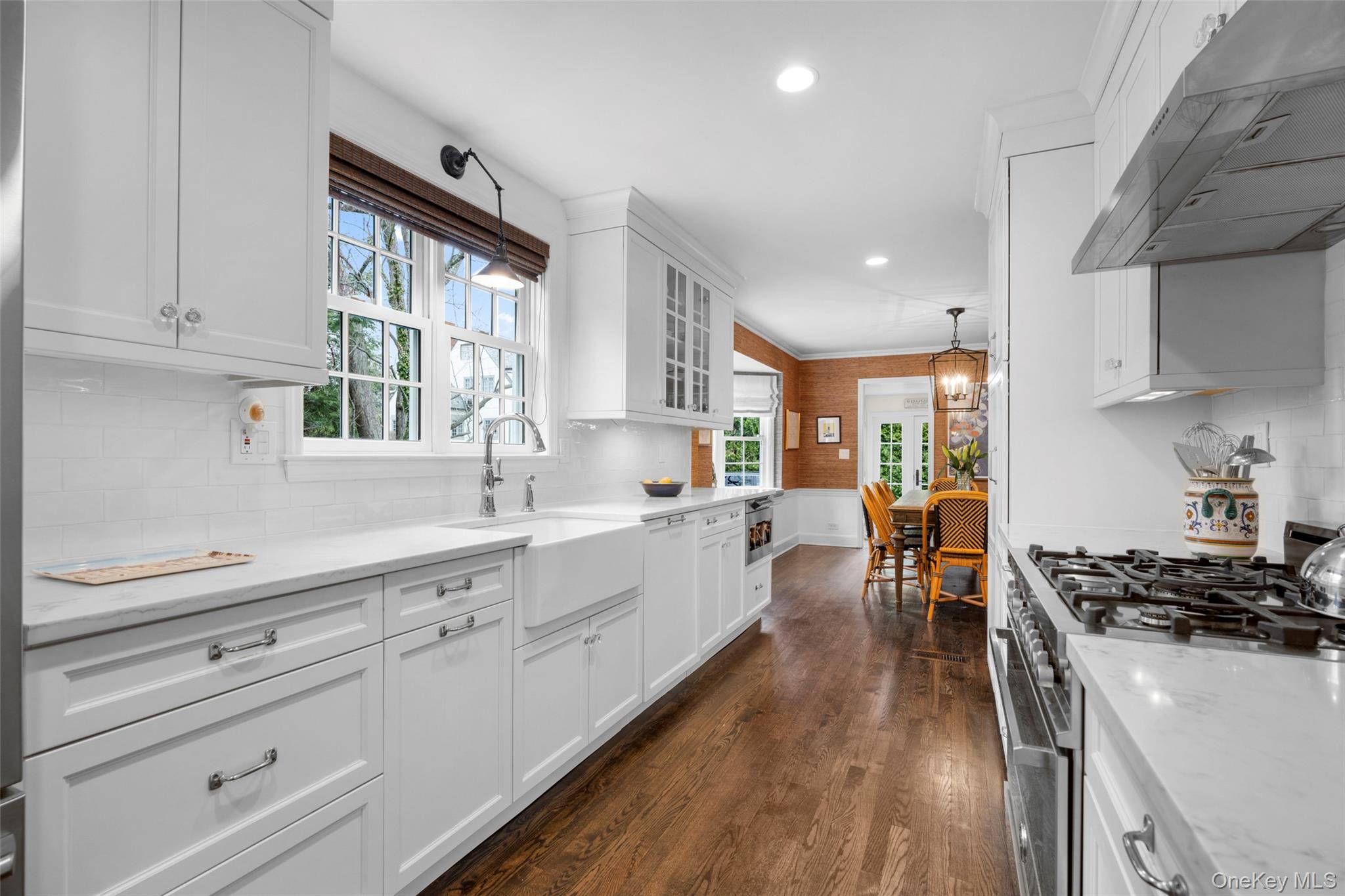 111 Berrian Road New Rochelle, NY 10804 - Photo 10 of 33 a large kitchen with stainless steel appliances a lot of counter space and a sink