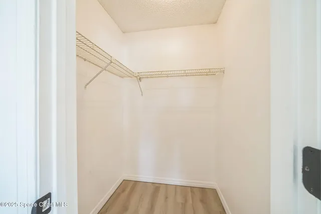 a view of a room with racks on the wall