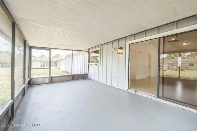 a view of an empty room and window