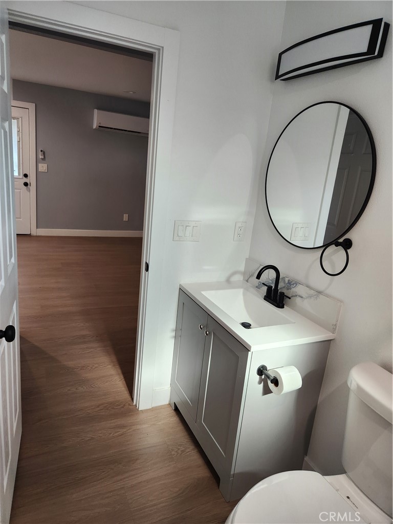 841 East H Street Colton, CA 92324 - Photo 11 of 23 a bathroom with a toilet and a sink