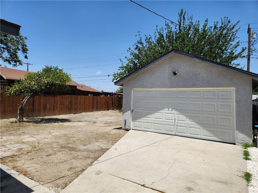 841 East H Street Colton, CA 92324 - Photo 16 of 23 a view of backyard space and tree