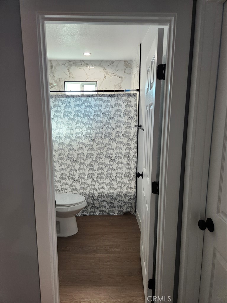 841 East H Street Colton, CA 92324 - Photo 9 of 23 a bathroom with a sink and a shower