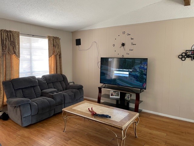 801 Old Austin Pflugerville Road Pflugerville, TX 78660 - Photo 19 of 24 a living room with furniture and a flat screen tv