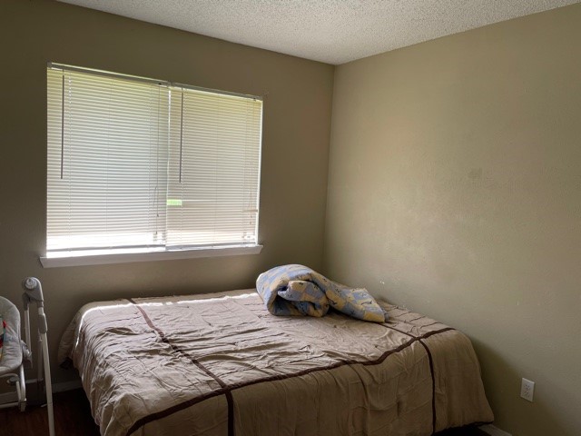 801 Old Austin Pflugerville Road Pflugerville, TX 78660 - Photo 7 of 24 a bedroom with a bed and a window