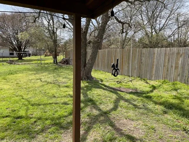 a swimming pool with outdoor seating and yard
