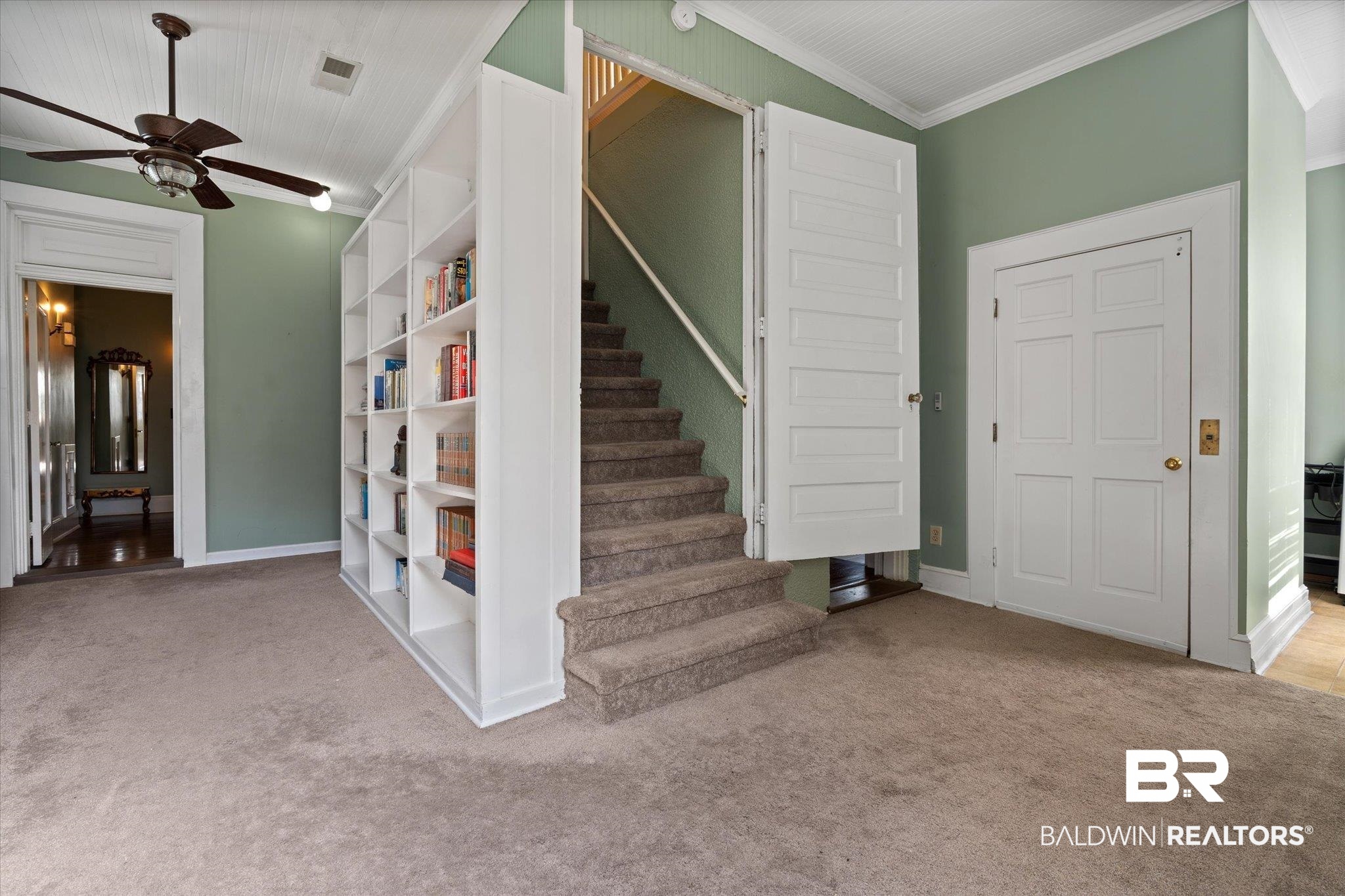 1953 Dauphin Street Mobile, AL 36606 - Photo 26 of 56 Stairs with carpet flooring, ceiling fan, and crown molding