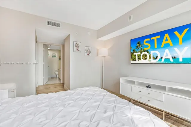 a bedroom with a bed and a cabinets