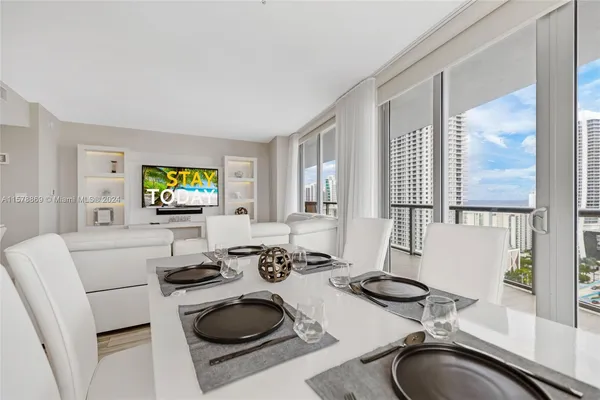 a kitchen with a sink a stove and a granite counter top
