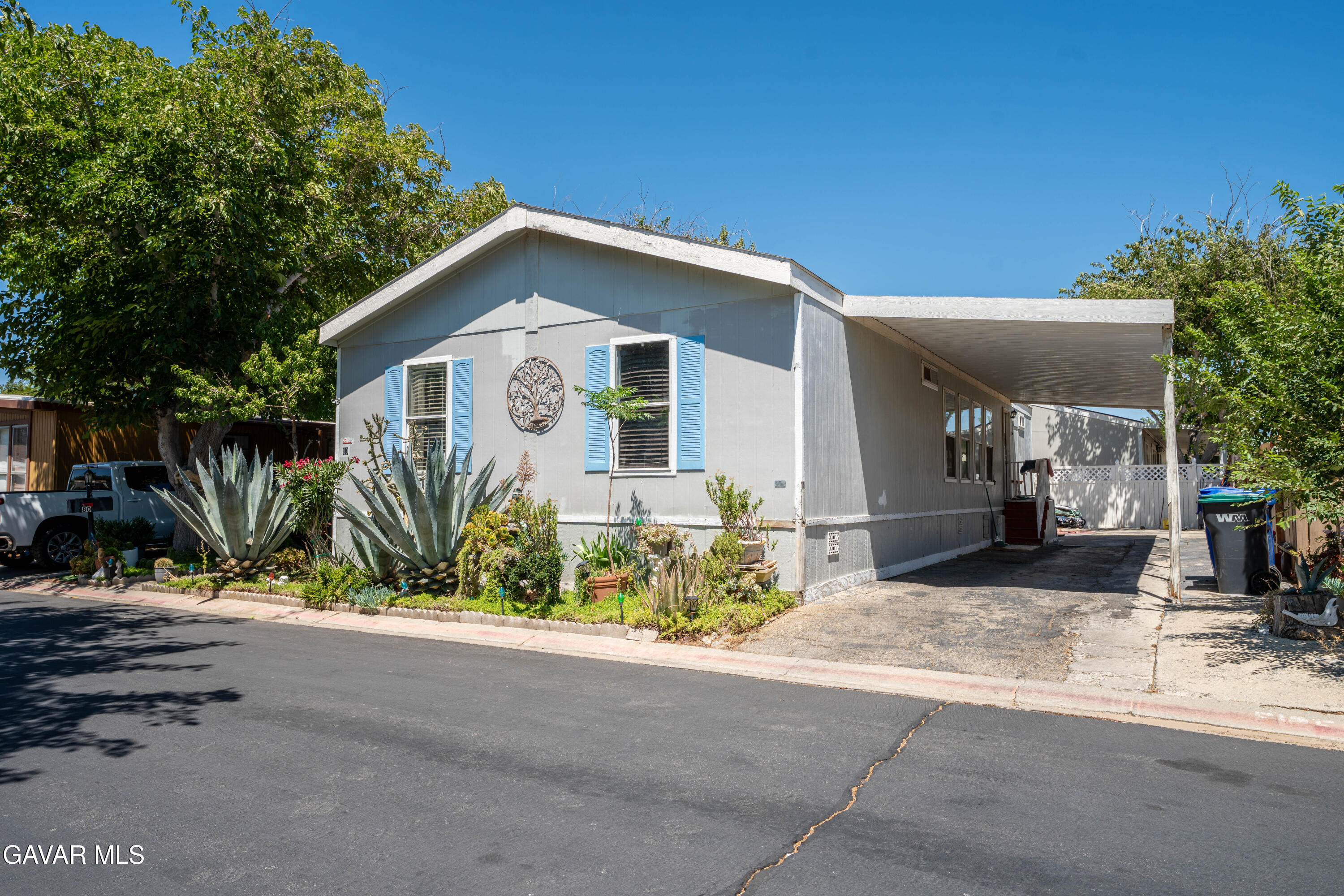 3524 Avenue R Palmdale, CA 93550 - Photo 1 of 3 a front view of a house with a yard and garage