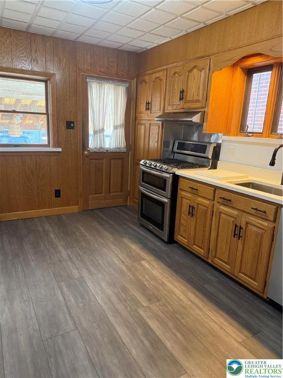 2014 Green Street Allentown, PA 18104 - Photo 12 of 14 a kitchen with granite countertop a stove a sink and wooden cabinets