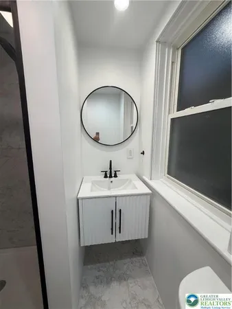 a bathroom with a shower and a toilet