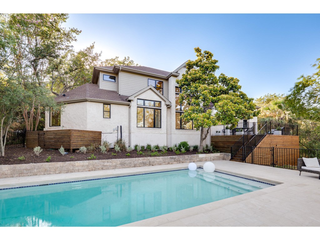 531 Beardsley Lane Austin, TX 78746 - Photo 1 of 1 a swimming pool with outdoor seating and yard