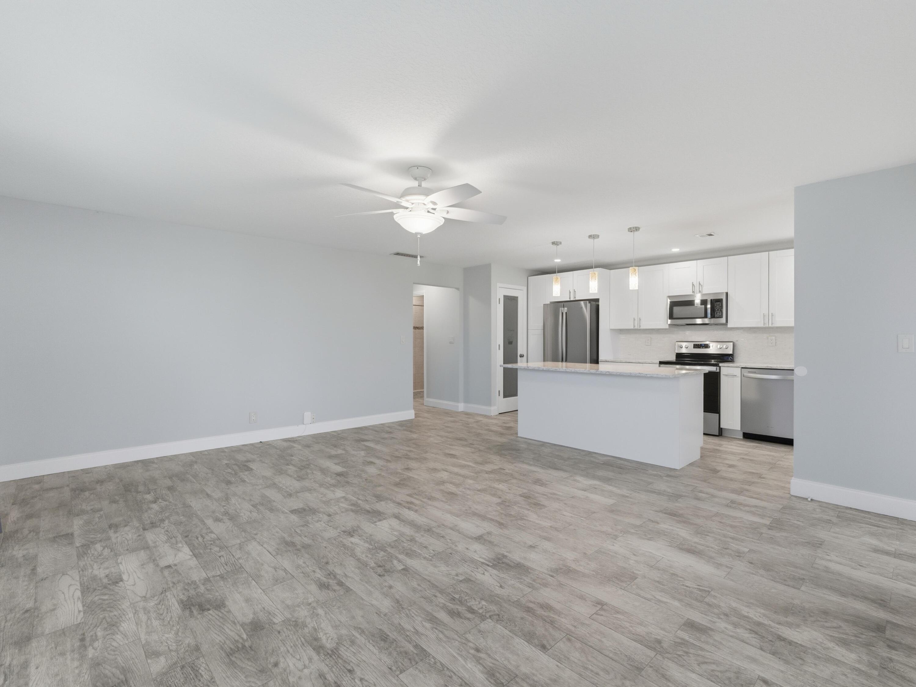 270 High Point Boulevard, Unit A Boynton Beach, FL 33435 - Photo 11 of 44 a view of a kitchen with microwave and cabinets