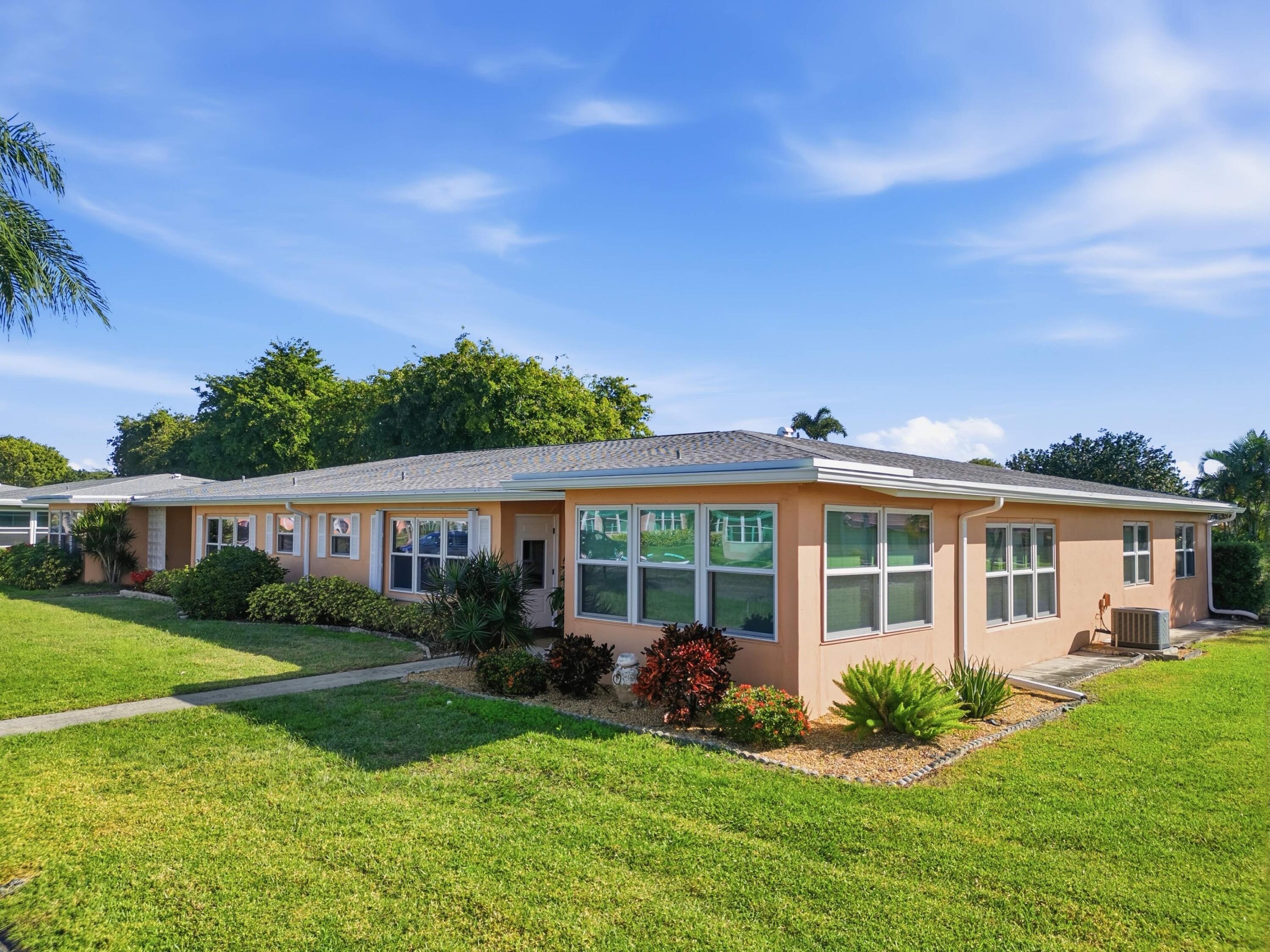 270 High Point Boulevard, Unit A Boynton Beach, FL 33435 - Photo 2 of 44 front view of a house with a yard