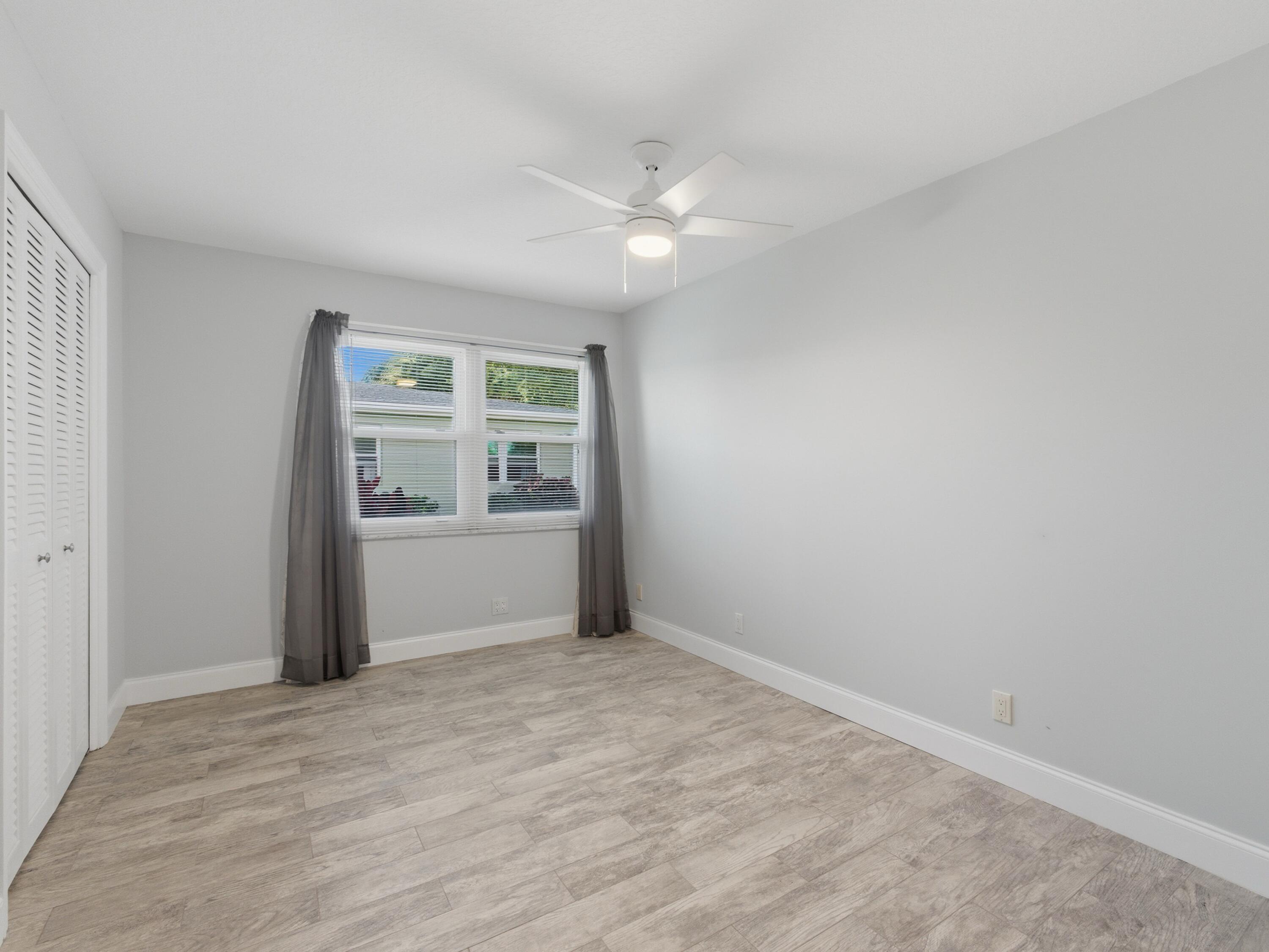 270 High Point Boulevard, Unit A Boynton Beach, FL 33435 - Photo 24 of 44 a view of an empty room with a window