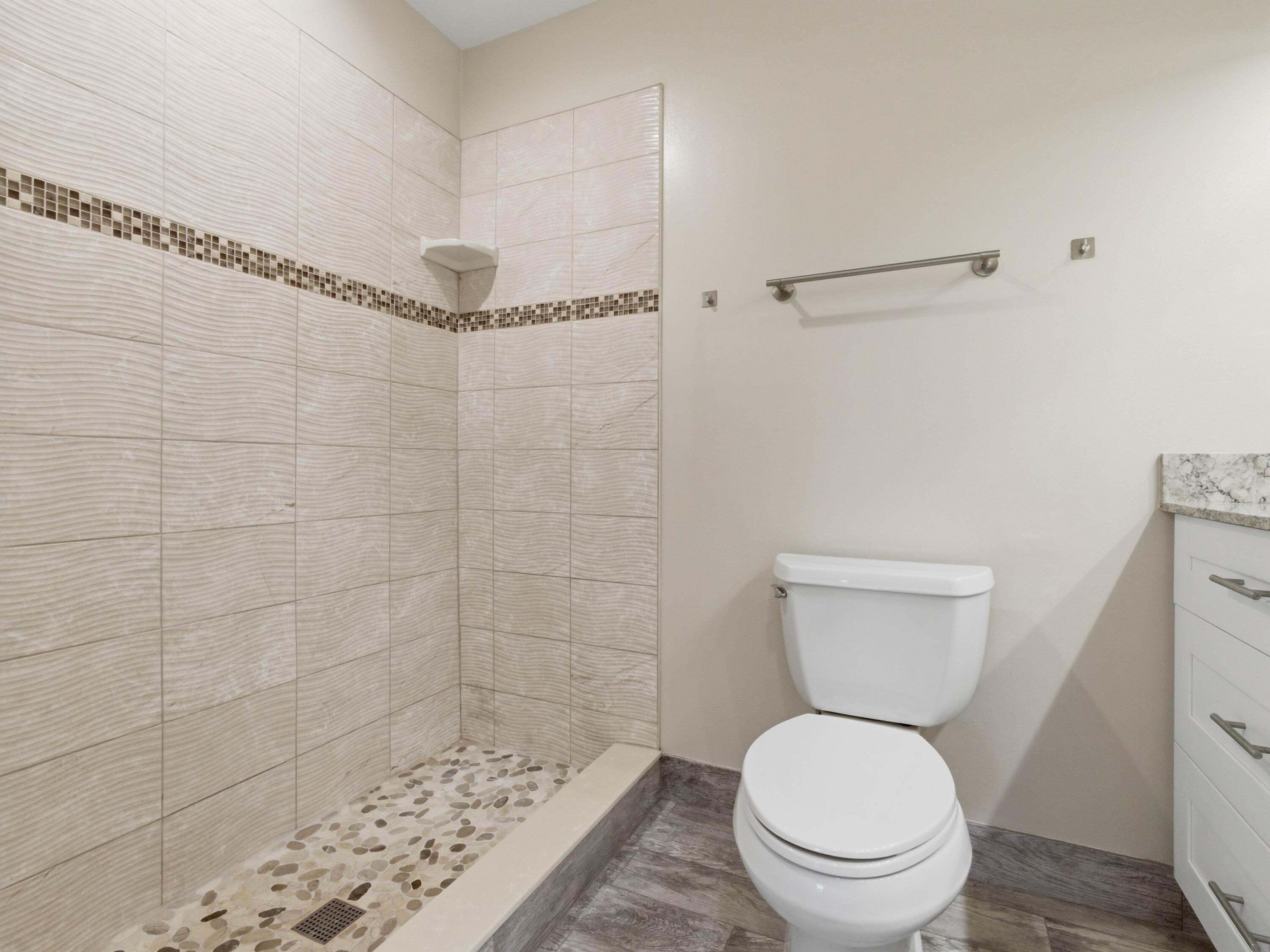 270 High Point Boulevard, Unit A Boynton Beach, FL 33435 - Photo 28 of 44 a bathroom with a toilet and a shower