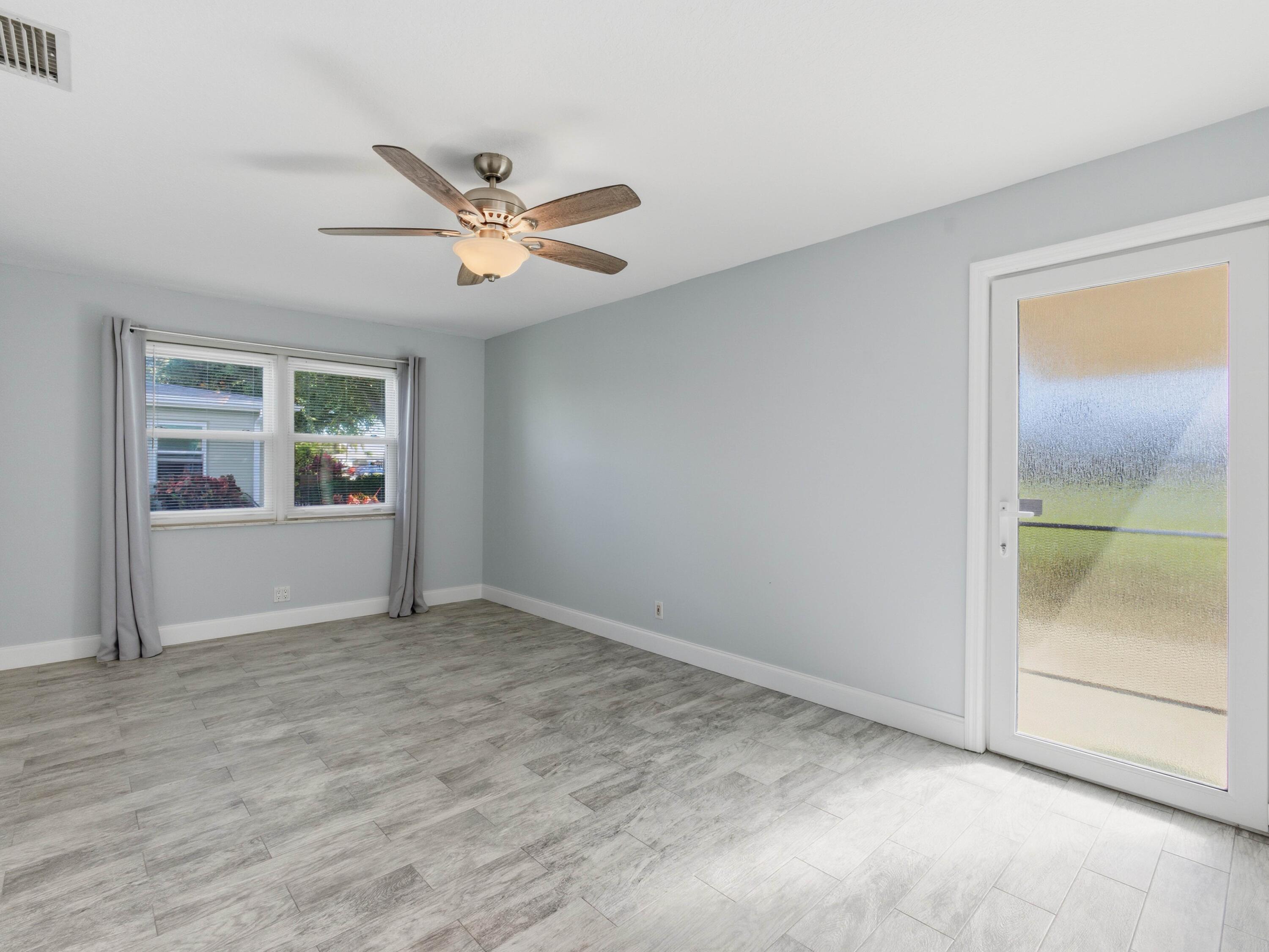 270 High Point Boulevard, Unit A Boynton Beach, FL 33435 - Photo 29 of 44 a view of an empty room with a window