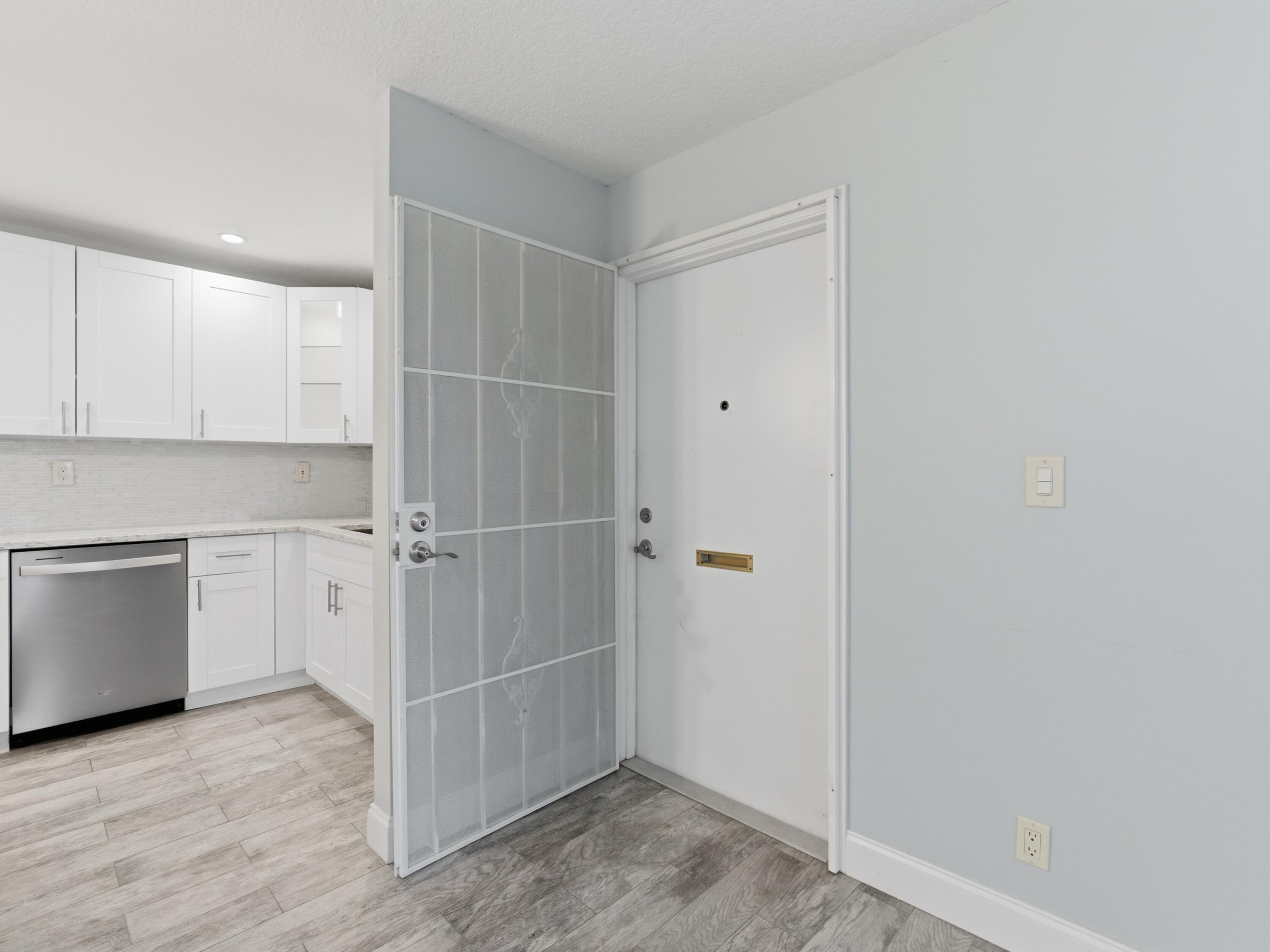 270 High Point Boulevard, Unit A Boynton Beach, FL 33435 - Photo 7 of 44 a view of an empty room with closet and wooden floor